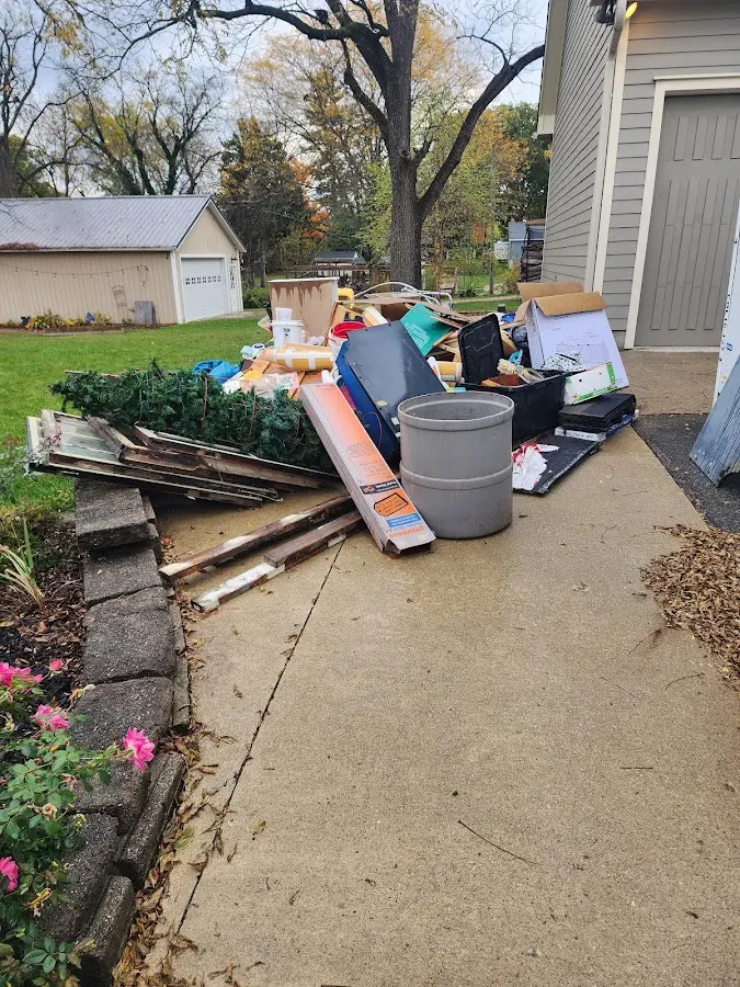 Dumpster being loaded with debris for 3 Yard Dumpster Rental in Warrenton